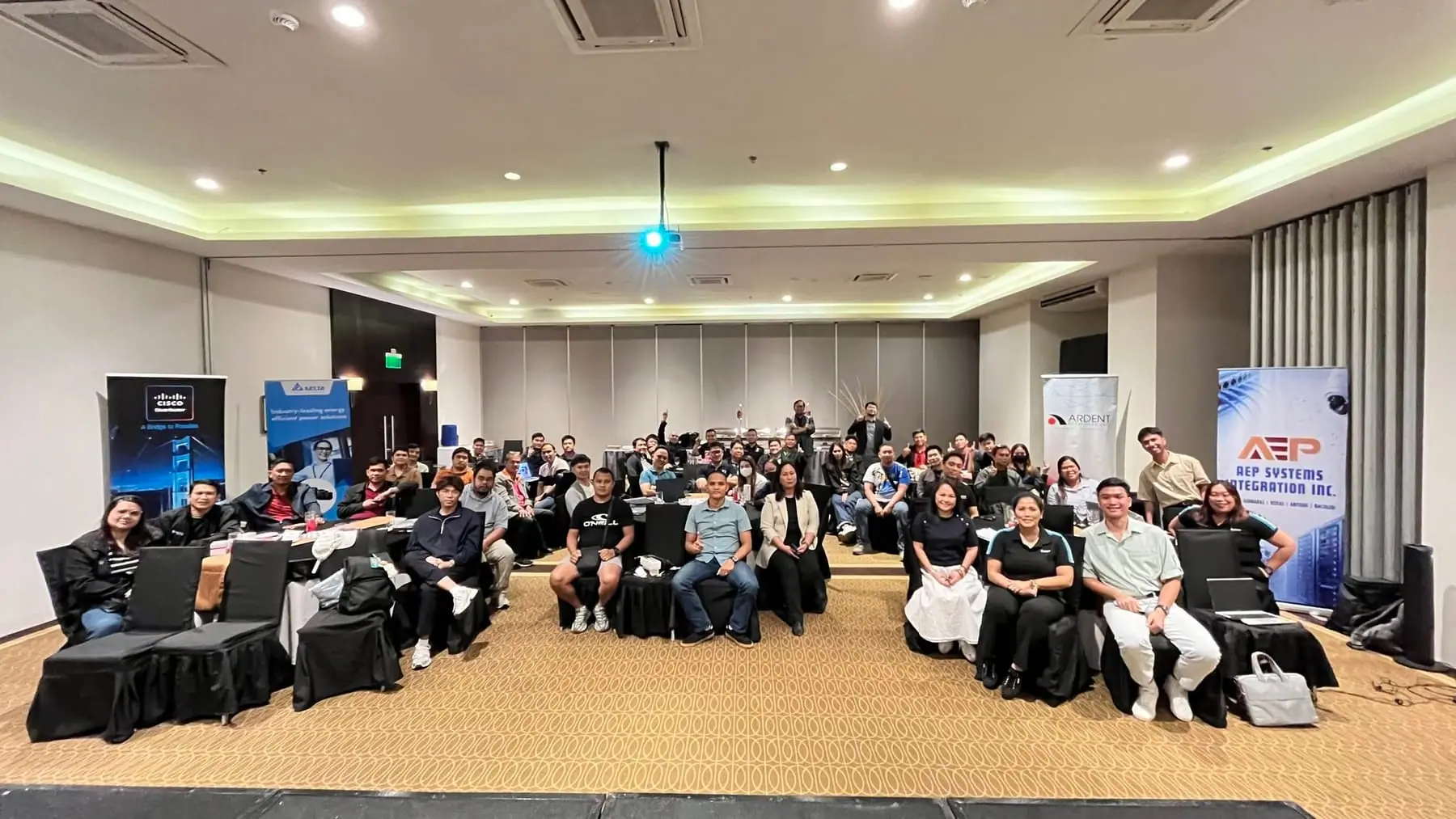 Group photo of attendees at the Cisco and Delta event