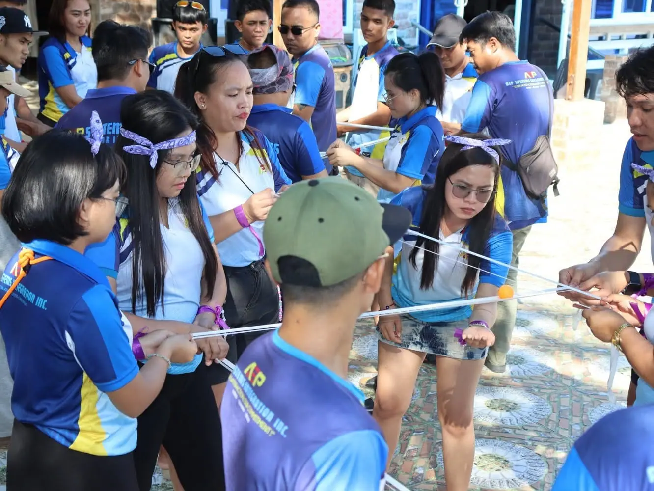 Team members playing a group game outdoors