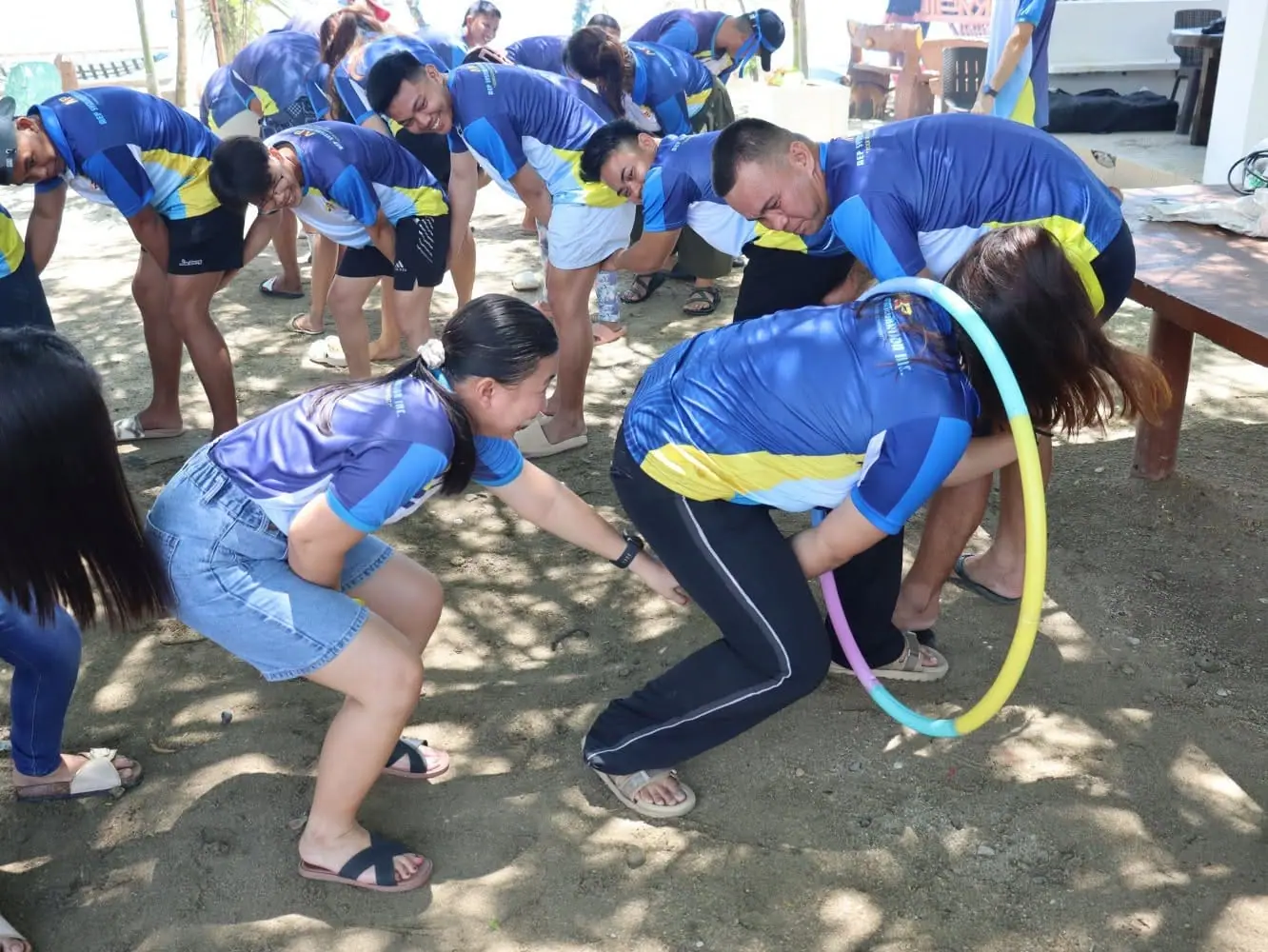 Team members in a hula-hoop relay
