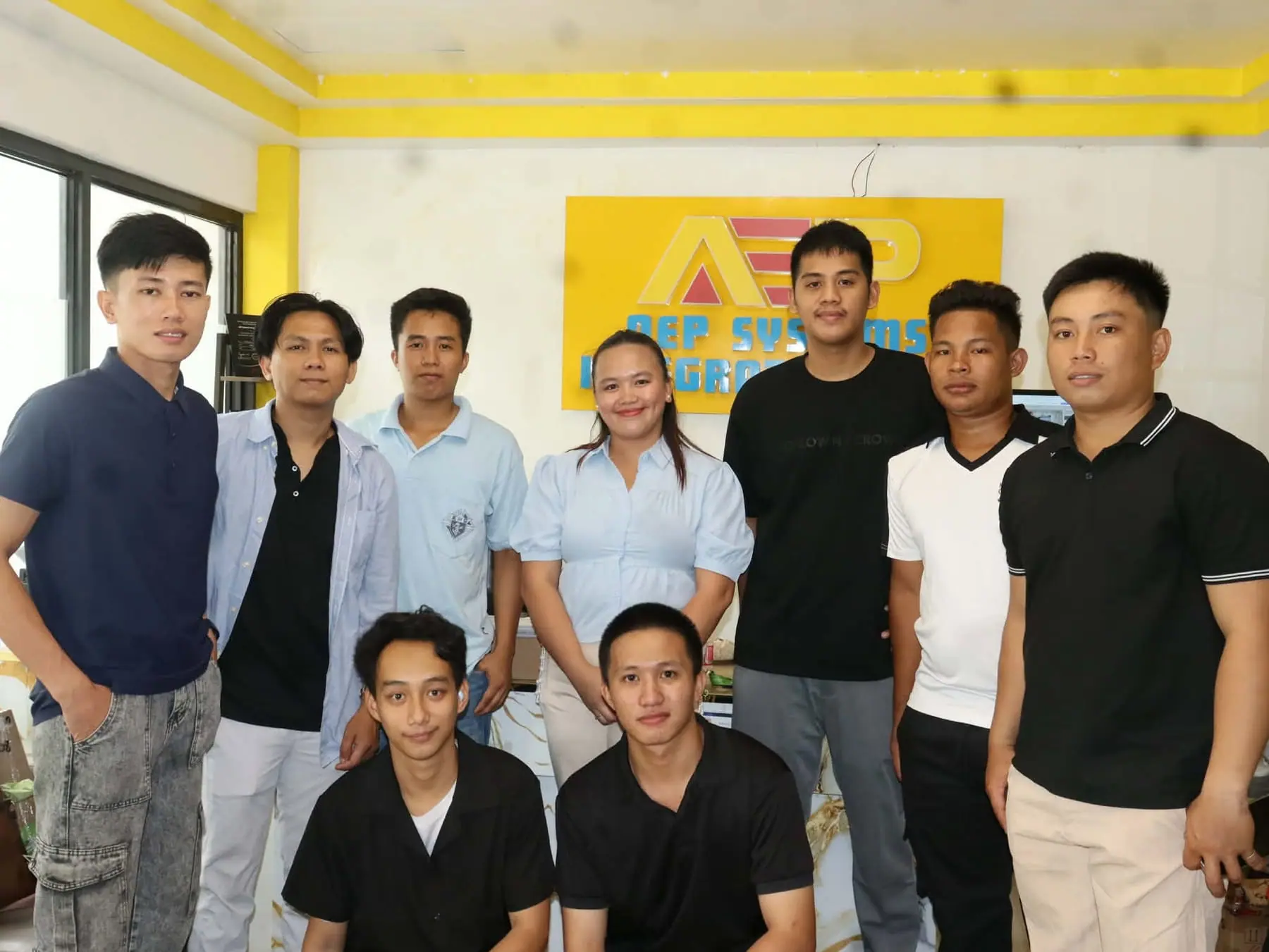 AEP team group photo under the AEP logo