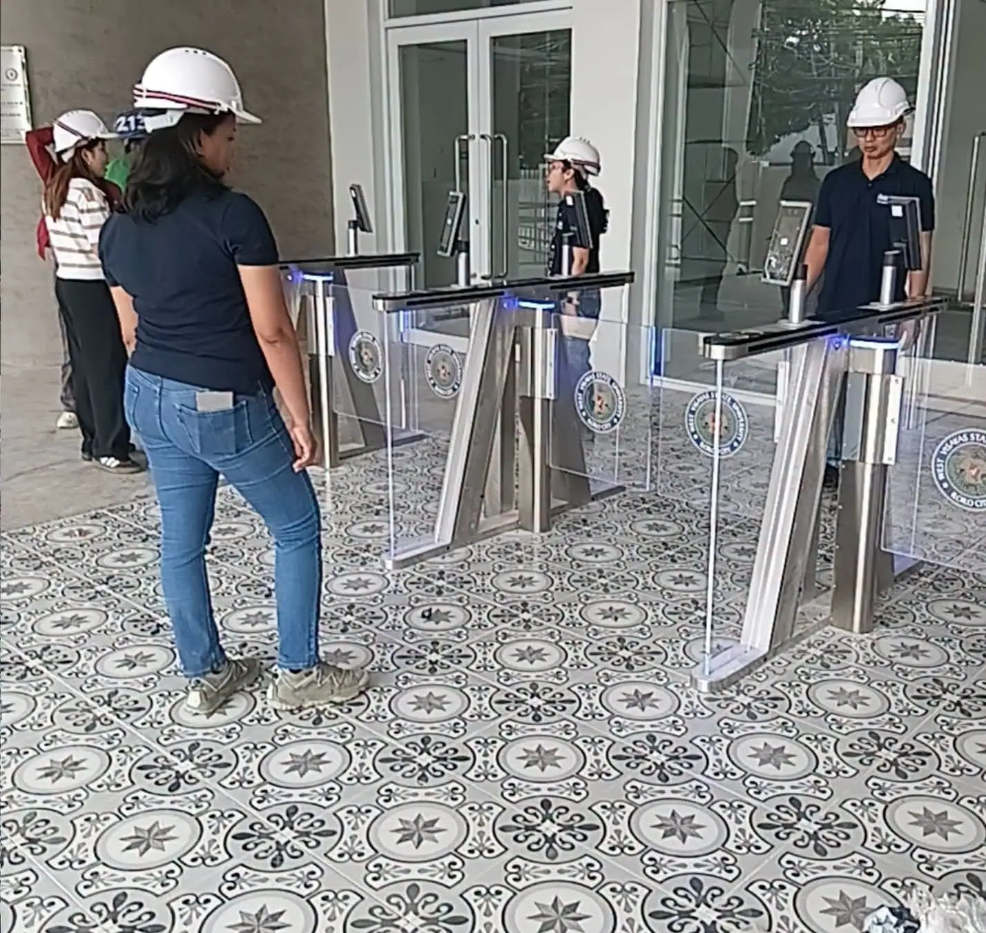 AEP team in hard hats checking newly installed turnstiles